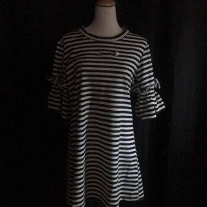 Knit mini dress with bell sleeves and pearl accent